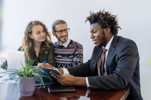 Photo by Antoni Shkraba: https://www.pexels.com/photo/man-in-black-suit-jacket-sitting-beside-woman-in-brown-and-black-long-sleeve-shirt-5816288/